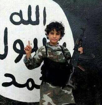 Nine year-old with rifle in ISIS controlled Iraq. 